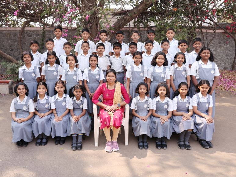 Std IV B - Mrs. Kamini Kolpe