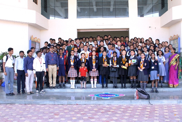 A group photograph of the visitors with the students of Std IX and our teachers.